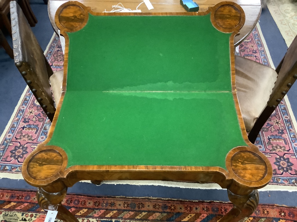 A Queen Anne revival walnut concertina folding card table, stamped Gill and Reigate, London retailed by S & H Jewell, width 81cm, depth 40cm, height 75cm